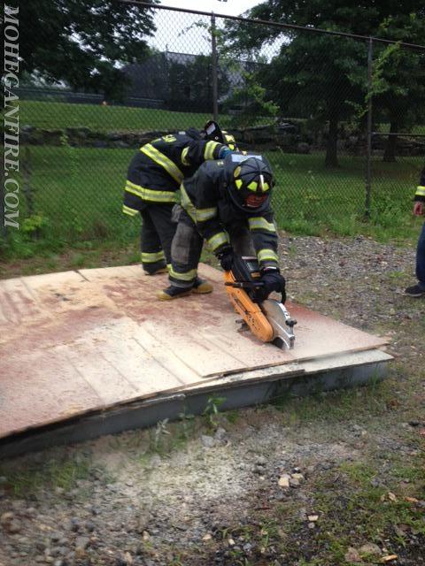 Probationary Firefighters Performing Roof Ventilation Training At Westchester County Fire Training Center On 7/15/14
